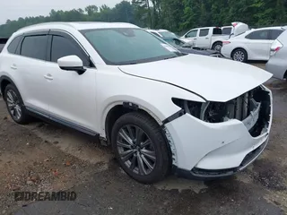 2021 Mazda CX-9 Signature with VIN JM3TCBEY4M0517118, listed as a IAAI auction lot 42400675 with 56,260 mi miles and . Bid and sale history available at DreamBid. Image 1.