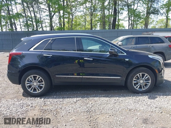 2021 Cadillac XT5 AWD Premium Luxury z VIN 1GYKNDRS8MZ217572, wystawiony jako IAAI lot #42190571 z przebiegiem 25 100 mil mil oraz . Historia ofert i sprzedaży dostępna na DreamBid. Obrazek 13.
