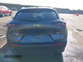 2022 Mazda CX-30 S Premium with VIN 3MVDMBDL0NM413867, listed as a IAAI auction lot 42082560 with 12,375 mi miles and . Bid and sale history available at DreamBid. Image 16.