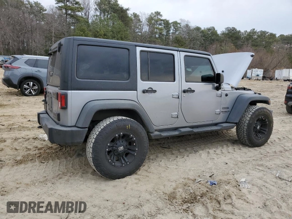 2015 Jeep Wrangler Unlimited Willys Wheeler with VIN 1C4BJWDG4FL723924, listed as a Copart auction lot 47145245 with 166,256 mi miles and Salvage Title. Bid and sale history available at DreamBid. Image 3.
