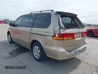 2002 Honda Odyssey EX-L z VIN 2HKRL18042H567858, wystawiony jako IAAI lot #41686147 z przebiegiem 264 570 mil mil oraz . Historia ofert i sprzedaży dostępna na DreamBid. Obrazek 3.