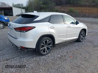 2021 Lexus RX with VIN 2T2HZMDA5MC287152, listed as a IAAI auction lot 41919634 with 25,668 mi miles. Bid and sale history available at carsss.com. Image 4.