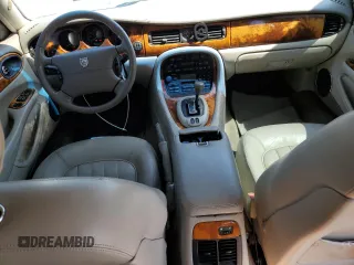 1999 Jaguar XJ with VIN SAJHX604XXC854217, listed as a Copart auction lot 56042735 with 127,092 mi miles and Salvage title. Bid and sale history available at DreamBid. Image 8.