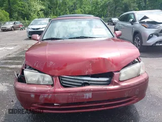 2000 Toyota Camry CE z VIN JT2BG22K3Y0521541, wystawiony jako IAAI lot #42074772 z przebiegiem 144 587 mil mil oraz . Historia ofert i sprzedaży dostępna na DreamBid. Obrazek 12.