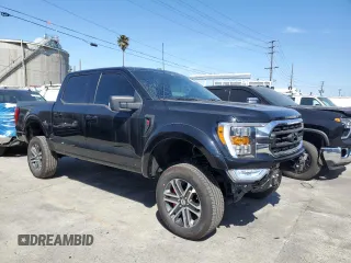 2021 Ford F-150 XL with VIN 1FTFW1E54MFD11453, listed as a Copart auction lot 50240015 with 8,645 mi miles and Salvage title. Bid and sale history available at DreamBid. Image 4.