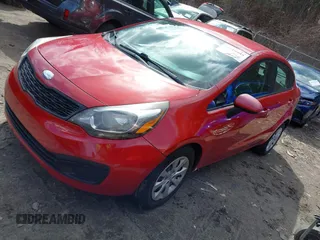 2014 Kia Rio LX with VIN KNADM4A31E6370963, listed as a IAAI auction lot 41720980 with 112,551 mi miles and . Bid and sale history available at DreamBid. Image 2.