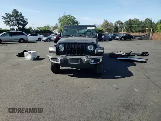 2023 Jeep Gladiator Sport z VIN 1C6HJTAG3PL530833, wystawiony jako Copart lot #56236565 z przebiegiem 15 967 mil mil oraz Szkoda całkowita • Salvage title. Historia ofert i sprzedaży dostępna na DreamBid. Obrazek 14.