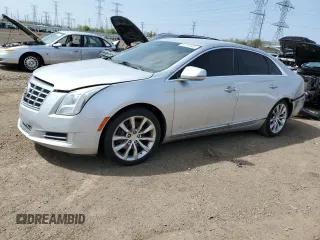 2013 Cadillac XTS Luxury z VIN 2G61P5S36D9238051, wystawiony jako Copart lot #54752405 z przebiegiem 148 194 mil mil oraz Szkoda całkowita • Salvage title. Historia ofert i sprzedaży dostępna na DreamBid. Obrazek 1.