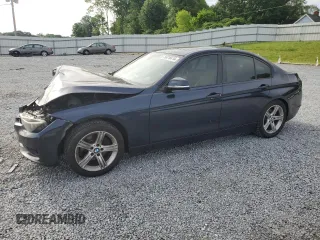 2014 BMW 3 Series 320i with VIN WBA3B1G58ENS79011, listed as a Copart auction lot 56018415 with 205,142 mi miles and Salvage title. Bid and sale history available at DreamBid. Image 1.