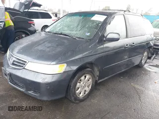 2004 Honda Odyssey EX-L with VIN 5FNRL18974B015769, listed as a IAAI auction lot 41533063 with 284,923 mi miles and . Bid and sale history available at DreamBid. Image 2.