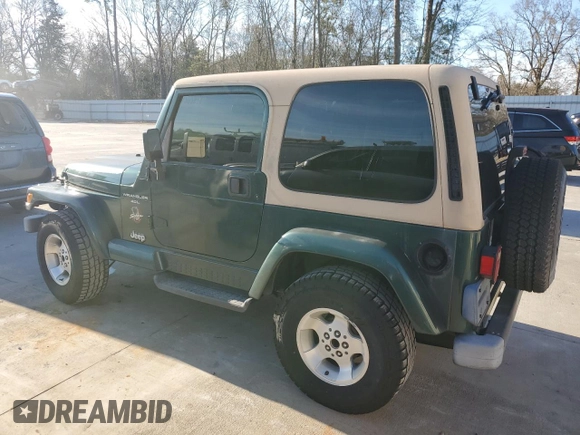 2000 Jeep Wrangler Sahara with VIN 1J4FA59S0YP795198, listed as a Copart auction lot 87920205 with 150,148 mi miles and Salvage Title. Bid and sale history available at carsss.com. Image 2.