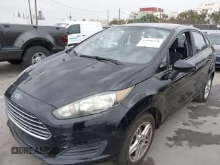 2017 Ford Fiesta SE z VIN 3FADP4BJ7HM145271, wystawiony jako IAAI lot #42056576 z przebiegiem 128 847 mil mil oraz . Historia ofert i sprzedaży dostępna na DreamBid. Obrazek 6.