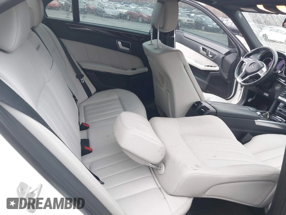 2014 Mercedes-Benz E 550 Sport with VIN WDDHF9BBXEA940995, listed as a IAAI auction lot 41872452 with 50,451 mi miles and . Bid and sale history available at DreamBid. Image 8.