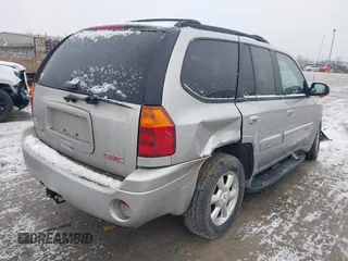 2005 GMC Envoy SLT with VIN 1GKDT13S352258640, listed as a IAAI auction lot 41226997 with 159,665 mi miles. Bid and sale history available at carsss.com. Image 4.
