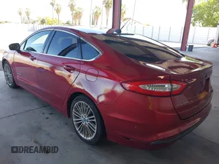 2013 Ford Fusion SE Hybrid z VIN 3FA6P0LU9DR183625, wystawiony jako IAAI lot #42338533 z przebiegiem 159 546 mil mil oraz . Historia ofert i sprzedaży dostępna na DreamBid. Obrazek 3.