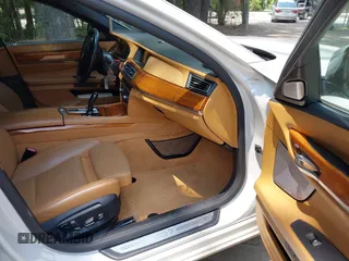 2013 BMW 7 Series 750Li with VIN WBAYE8C55DDS16013, listed as a IAAI auction lot 42709519 with 123,405 mi miles and . Bid and sale history available at DreamBid. Image 5.