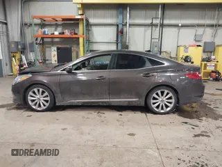 2015 Hyundai Azera Limited z VIN KMHFH4JG2FA432545, wystawiony jako IAAI lot #41329236 z przebiegiem 98 661 mil mil oraz . Historia ofert i sprzedaży dostępna na DreamBid. Obrazek 14.