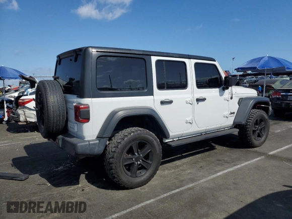 2019 Jeep Wrangler Unlimited Sport Altitude with VIN 1C4HJXDG2KW675235, listed as a Copart auction lot 54389785 with 88,825 mi miles and Salvage title. Bid and sale history available at DreamBid. Image 3.