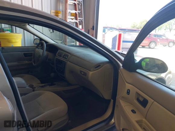 2003 Ford Taurus SE Standard with VIN 1FAFP53U13G229161, listed as a IAAI auction lot 39753697 with 94,195 mi miles. Bid and sale history available at carsss.com. Image 5.