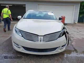 2014 Lincoln MKZ z VIN 3LN6L2G95ER808560, wystawiony jako IAAI lot #42288383 z przebiegiem 97 298 mil mil oraz . Historia ofert i sprzedaży dostępna na DreamBid. Obrazek 13.