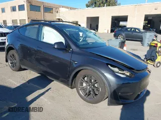 2024 Tesla Model Y Long Range with VIN 7SAYGAEE7RF126351, listed as a IAAI auction lot 41282973 with 5,919 mi miles. Bid and sale history available at carsss.com. Image 1.