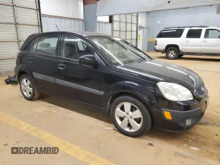 2009 Kia Rio LX with VIN KNADE243896580883, listed as a Copart auction lot 43735505 with 135,726 mi miles and Salvage Title. Bid and sale history available at carsss.com. Image 4.