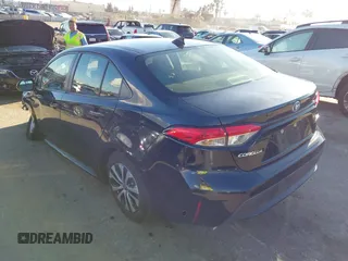 2021 Toyota Corolla Hybrid LE with VIN JTDEAMDE5MJ014959, listed as a IAAI auction lot 41751203 with 26,220 mi miles. Bid and sale history available at carsss.com. Image 3.