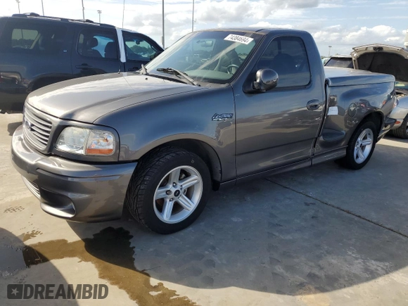 2003 Ford F-150 Lightning with VIN 2FTRF07303CA45572, listed as a Copart auction lot 74384694 with 0 mi miles and Salvage Title. Bid and sale history available at carsss.com. Image 1.