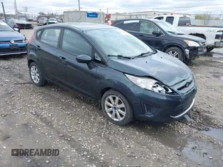 2011 Ford Fiesta SE with VIN 3FADP4EJ4BM228417, listed as a IAAI auction lot 42061494 with 86,873 mi miles. Bid and sale history available at carsss.com. Image 1.