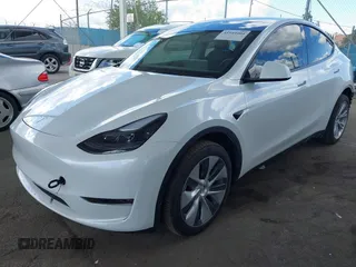2024 Tesla Model Y Long Range with VIN 7SAYGDEE5RA222333, listed as a IAAI auction lot 41944404 with 12,176 mi miles. Bid and sale history available at carsss.com. Image 2.