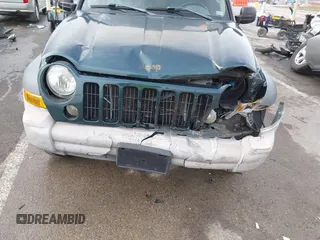 2005 Jeep Liberty Sport with VIN 1J4GL48K15W631101, listed as a IAAI auction lot 41217588 with 168,378 mi miles. Bid and sale history available at carsss.com. Image 6.