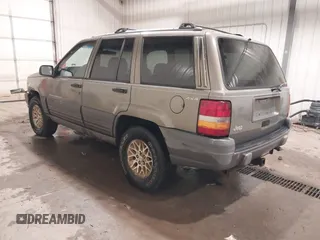 1996 Jeep Grand Cherokee Laredo with VIN 1J4GZ58S5TC182766, listed as a IAAI auction lot 41372356 with 234,390 mi miles. Bid and sale history available at carsss.com. Image 3.