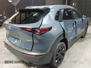 2022 Mazda CX-30 S Carbon Edition with VIN 3MVDMBCL8NM447234, listed as a IAAI auction lot 42511600 with 51,926 mi miles and . Bid and sale history available at DreamBid. Image 4.