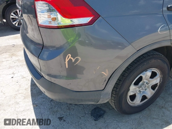 2013 Honda CR-V LX with VIN 3CZRM3H37DG708916, listed as a IAAI auction lot 42450090 with 118,002 mi miles and . Bid and sale history available at DreamBid. Image 18.