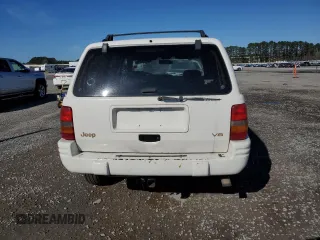 1998 Jeep Grand Cherokee Limited with VIN 1J4GZ78Y0WC307578, listed as a Copart auction lot 45272765 with 328,264 mi miles and Salvage title. Bid and sale history available at DreamBid. Image 6.