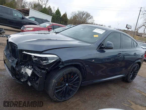 2022 BMW X6 xDrive40i z VIN 5UXCY6C08N9N30013, wystawiony jako IAAI lot #41772245 z przebiegiem 23 198 mil mil oraz . Historia ofert i sprzedaży dostępna na DreamBid. Obrazek 15.