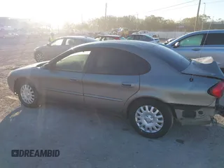 2003 Ford Taurus LX Standard with VIN 1FAFP52U33A235063, listed as a IAAI auction lot 41777293 with 164,125 mi miles and . Bid and sale history available at DreamBid. Image 14.