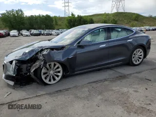 2017 Tesla Model S 100D with VIN 5YJSA1E25HF187898, listed as a Copart auction lot 60829025 with 82,823 mi miles and Salvage title. Bid and sale history available at DreamBid. Image 1.