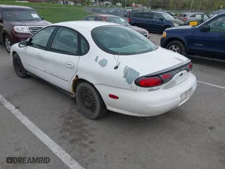 1999 Ford Taurus LX with VIN 1FAFP52U3XA234663, listed as a IAAI auction lot 41997339 with 243,150 mi miles. Bid and sale history available at carsss.com. Image 3.