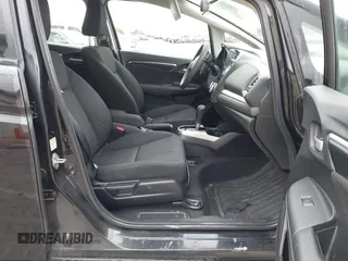 2015 Honda Fit EX-L z VIN 3HGGK5H8XFM733048, wystawiony jako IAAI lot #42267517 z przebiegiem Nie podano mil oraz . Historia ofert i sprzedaży dostępna na DreamBid. Obrazek 5.