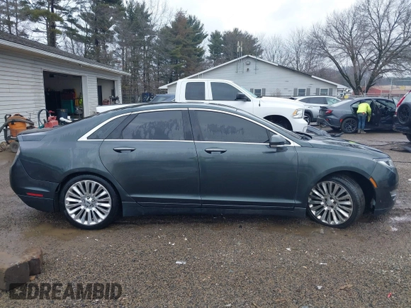 2015 Lincoln MKZ z VIN 3LN6L2J90FR616800, wystawiony jako IAAI lot #41683401 z przebiegiem 92 239 mil mil oraz . Historia ofert i sprzedaży dostępna na DreamBid. Obrazek 13.