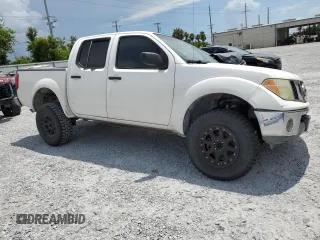 2005 Nissan Frontier LE with VIN 1N6AD07U65C417532, listed as a Copart auction lot 61588315 with 197,514 mi miles and Salvage title. Bid and sale history available at DreamBid. Image 4.