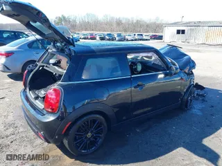 2024 MINI Hardtop 2 Door Cooper SE with VIN WMW13DJ03R2V25523, listed as a IAAI auction lot 41585964 with 7,690 mi miles. Bid and sale history available at carsss.com. Image 4.