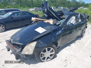 2008 Cadillac CTS RWD with VIN 1G6DF577080143965, listed as a IAAI auction lot 39774534 with 154,289 mi miles and . Bid and sale history available at DreamBid. Image 2.