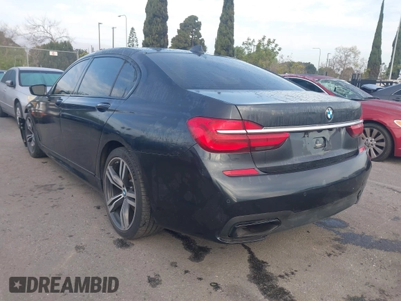 2016 BMW 7 Series 740i with VIN WBA7E2C51GG547537, listed as a IAAI auction lot 41794434 with 149,655 mi miles. Bid and sale history available at carsss.com. Image 3.