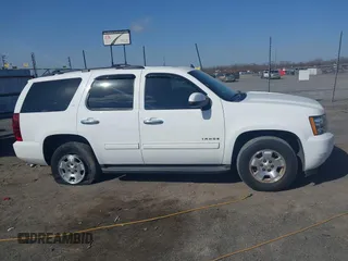 2014 Chevrolet Tahoe LT with VIN 1GNSCBE06ER233105, listed as a IAAI auction lot 41753190 with 161,056 mi miles and . Bid and sale history available at DreamBid. Image 13.