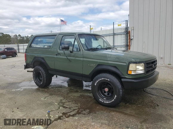 1992 Ford Bronco XL with VIN 1FMEU15N2NLA71562, listed as a Copart auction lot 48827285 with 198,042 mi miles and Salvage Title. Bid and sale history available at carsss.com. Image 4.