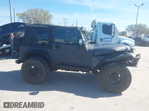 2003 Jeep Wrangler X with VIN 1J4FA39S03P314685, listed as a IAAI auction lot 41649741 with 119,924 mi miles. Bid and sale history available at carsss.com. Image 14.