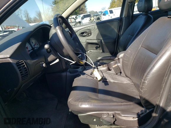2001 Saturn SL z VIN 1G8ZK54701Z301199, wystawiony jako Copart lot #48488335 z przebiegiem 96 151 mil mil oraz Szkoda całkowita • Salvage title. Historia ofert i sprzedaży dostępna na DreamBid. Obrazek 7.