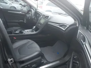 2016 Ford Fusion Titanium with VIN 3FA6P0K97GR118922, listed as a IAAI auction lot 42121212 with 256,584 mi miles and . Bid and sale history available at DreamBid. Image 5.